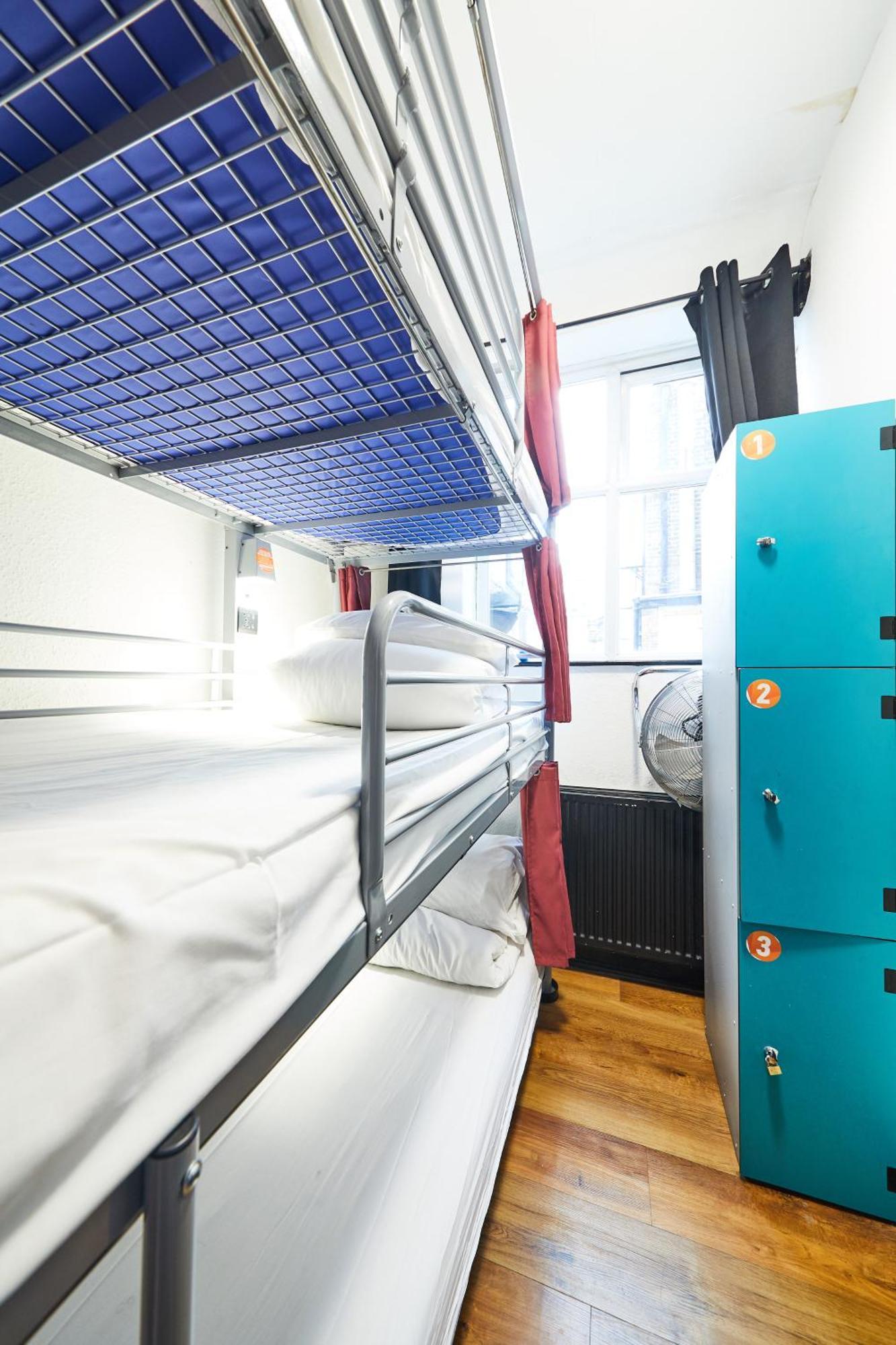 Posto Letto in Dormitorio Misto con 12 Letti e Bagno in Comune