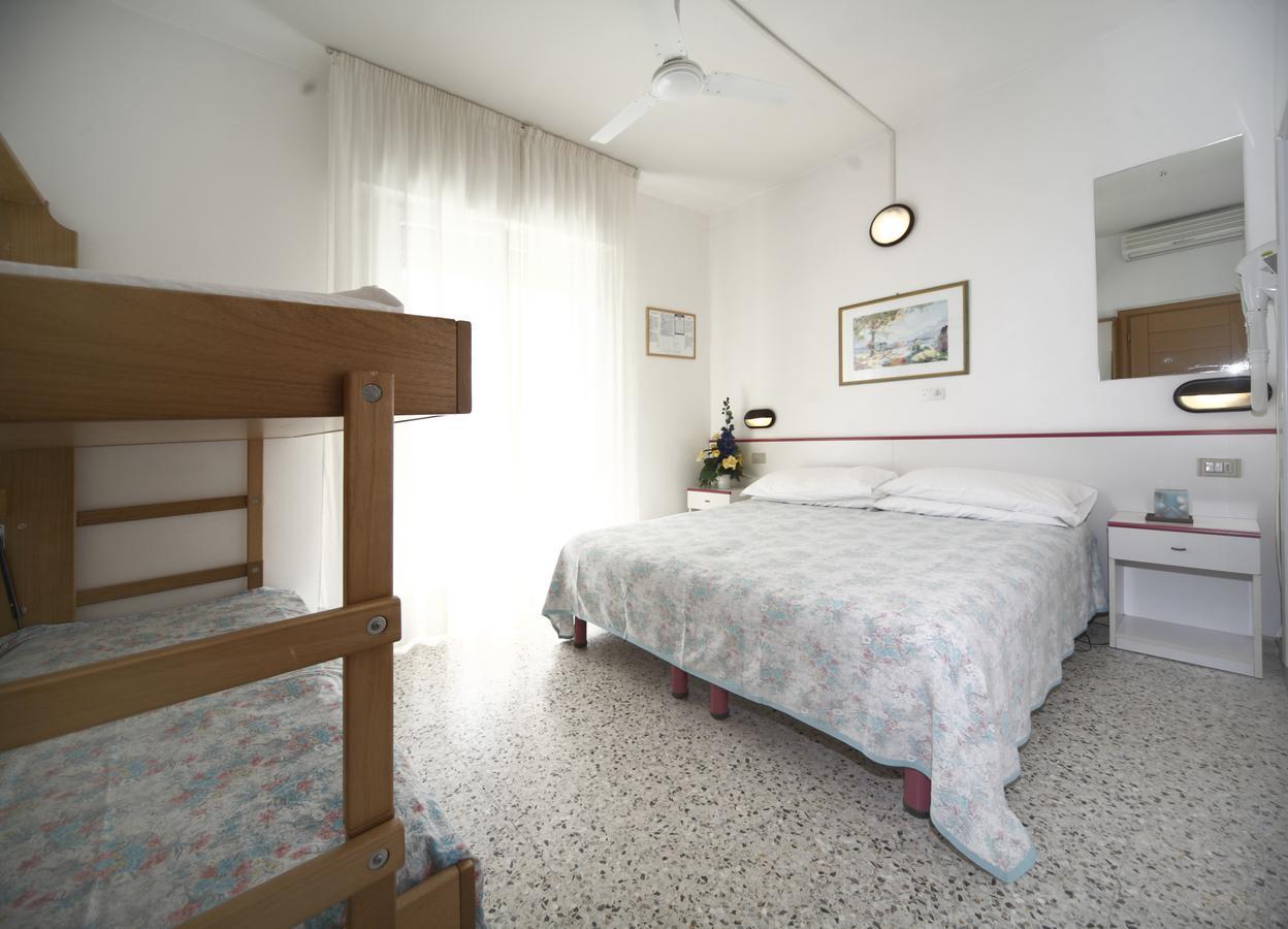 Economy Quadruple Room "shower without box, located in the center of the small bathroom"